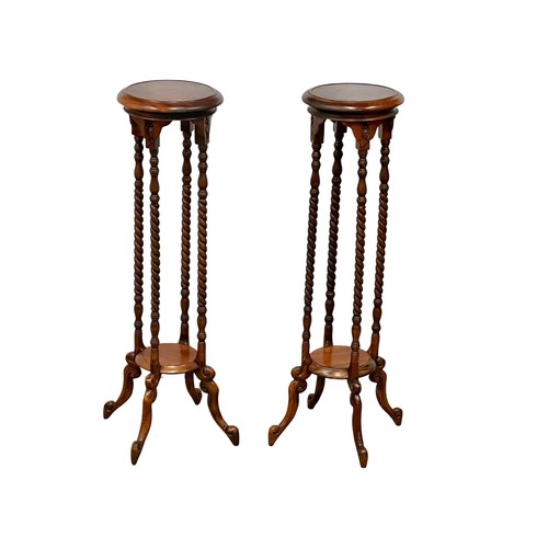 1154 - A pair of tall mahogany jardiniere stands with barley twist supports. 100cm