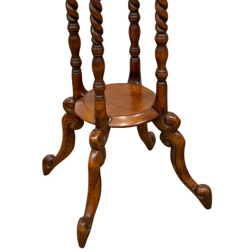 1154 - A pair of tall mahogany jardiniere stands with barley twist supports. 100cm