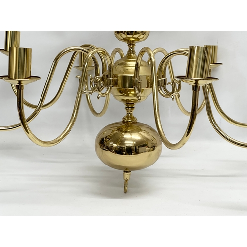 772 - A large brass chandelier. 80x96cm