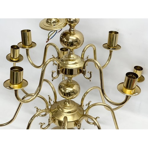 772 - A large brass chandelier. 80x96cm