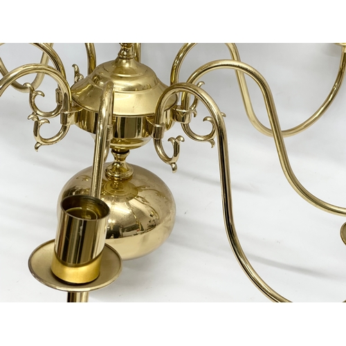 772 - A large brass chandelier. 80x96cm