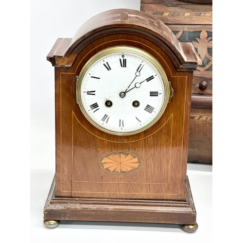 776 - A quantity of Victorian and Edwardian clocks. An inlaid mahogany mantle clock 23x14x31cm. A Late 19t... 