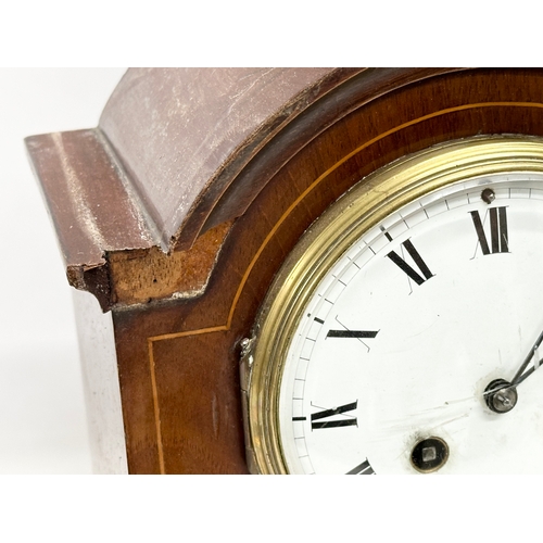 776 - A quantity of Victorian and Edwardian clocks. An inlaid mahogany mantle clock 23x14x31cm. A Late 19t... 