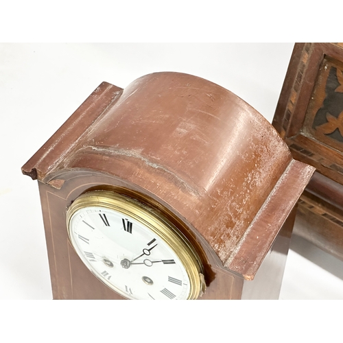 776 - A quantity of Victorian and Edwardian clocks. An inlaid mahogany mantle clock 23x14x31cm. A Late 19t... 