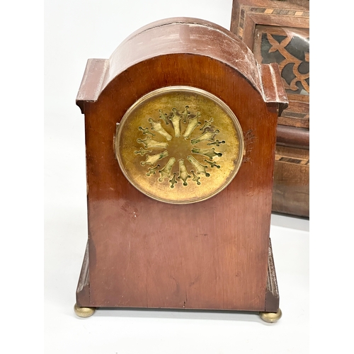 776 - A quantity of Victorian and Edwardian clocks. An inlaid mahogany mantle clock 23x14x31cm. A Late 19t... 