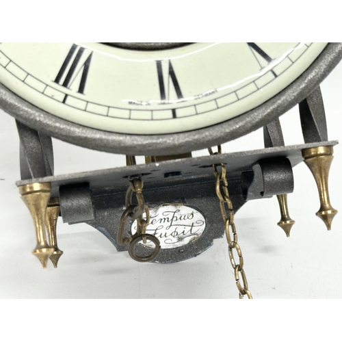 786 - A West German Tempus Fubit skeleton clock. With 1 weight and pendulum. 15x10x25cm