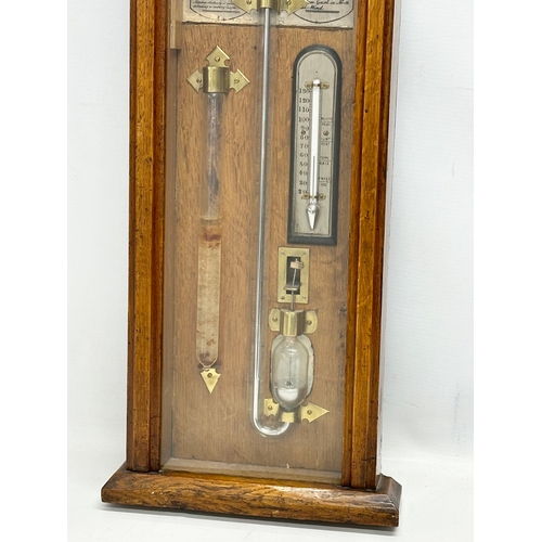 4 - The Atmoscope Barometer. By Admiral Fitzroy. Late 19th Century Victorian oak cased barometer. 37x117... 