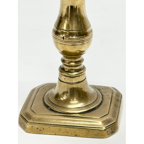 68 - A George III, Late 18th/Early 19th Century brass candlestick. 9x7.5x18cm