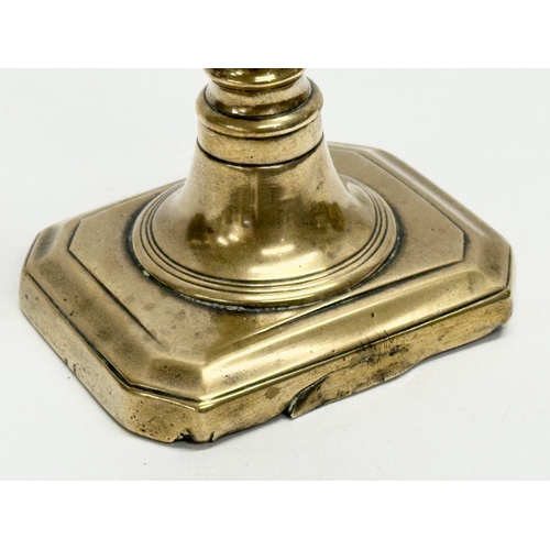 68 - A George III, Late 18th/Early 19th Century brass candlestick. 9x7.5x18cm