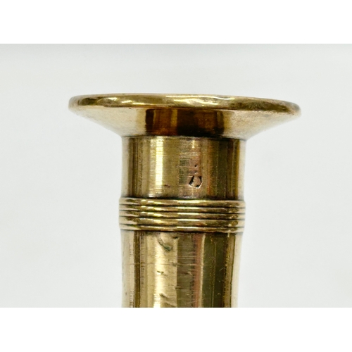 68 - A George III, Late 18th/Early 19th Century brass candlestick. 9x7.5x18cm