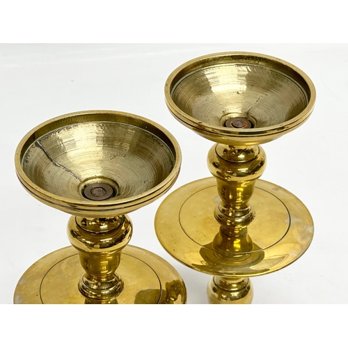 70 - A pair of Early/Mid 20th Century brass candlesticks. 19.5cm