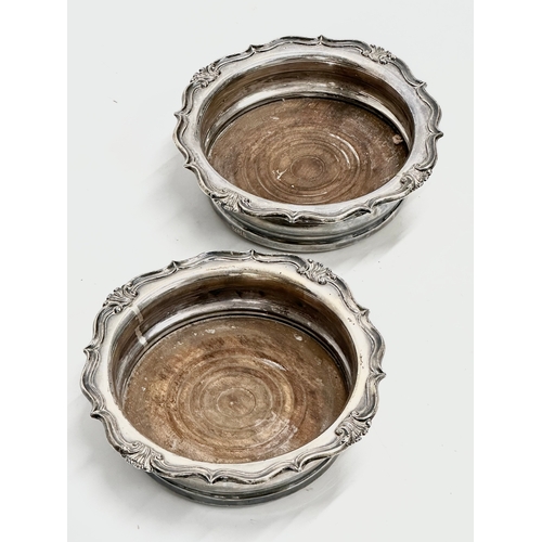 71 - A pair of large 19th Century silver plated bottle coasters. 18x18x5cm