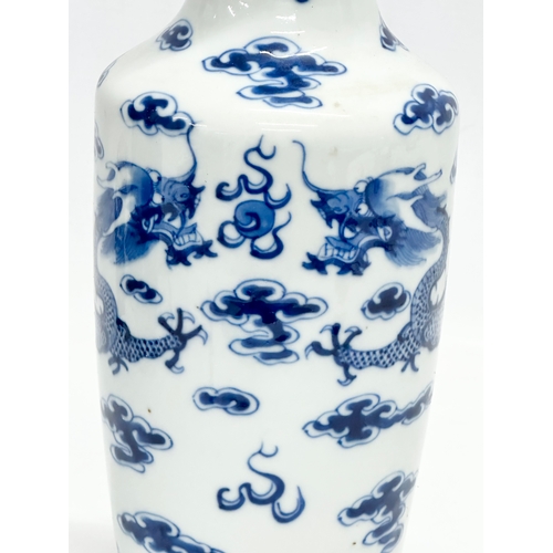 82 - A Late 19th Century Chinese vase. With two blue dragons, clouds and pearl of wisdom. Kangxi 4 charac... 