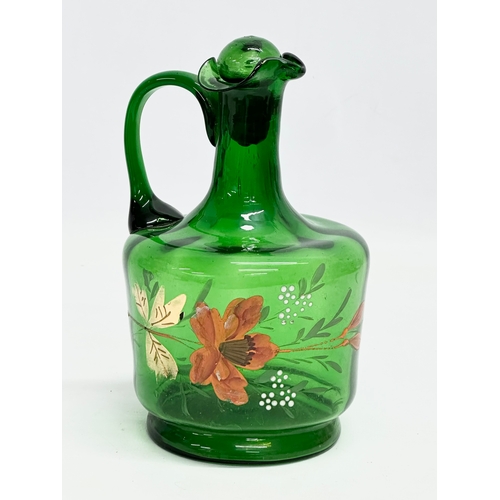 76 - 3 pieces of Late 19th Century hand painted Bristol Green glassware. 2 ewer decanters and a jar with ... 