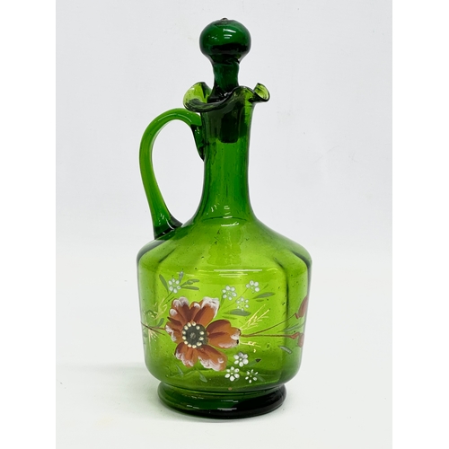 76 - 3 pieces of Late 19th Century hand painted Bristol Green glassware. 2 ewer decanters and a jar with ... 