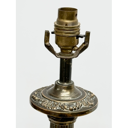 77 - A large Mid 20th Century brass table lamp with reeded column. 64cm