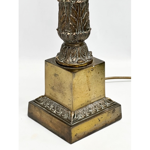 77 - A large Mid 20th Century brass table lamp with reeded column. 64cm