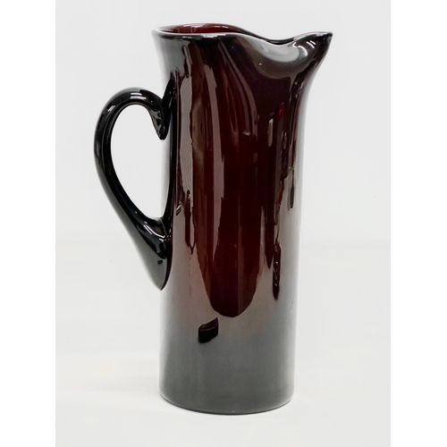 85 - A Mid Century amethyst glass pitcher jug. In the manner of Monica Bratt. 15x25cm