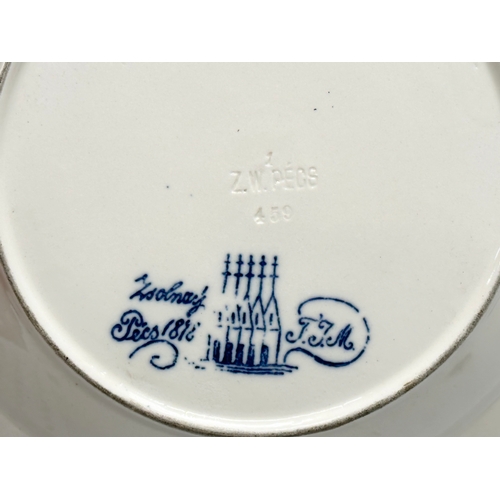 91 - Zsolnay Pecs. An Islamic style bowl by Zsolnay Pecs. Signed TJM. 5 castle mark. 25x4cm