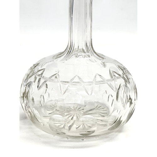 93 - A Late 19th Century Victorian lens cut decanter with 3 stoppers. 29cm