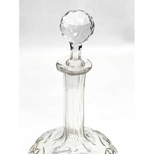 93 - A Late 19th Century Victorian lens cut decanter with 3 stoppers. 29cm