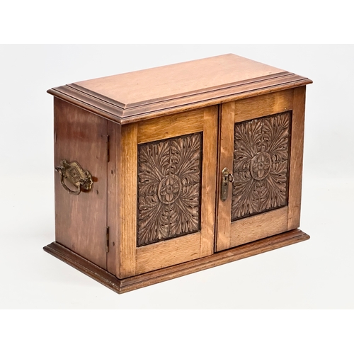 86 - A Late 19th Century Victorian oak tabletop humidor smokers cabinet. 37.5x21x27cm