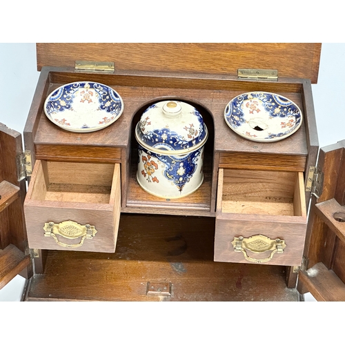 86 - A Late 19th Century Victorian oak tabletop humidor smokers cabinet. 37.5x21x27cm