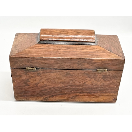 87 - A Regency rosewood sarcophagus tea caddy with nickel silver spoon. Circa 1810. 23x12x14cm