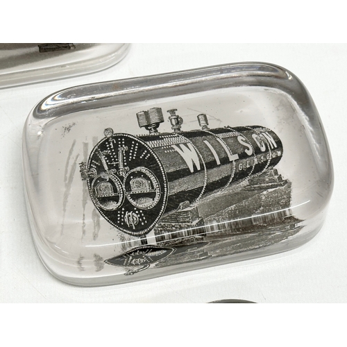 139 - 3 Early 20th Century Wilson Boiler advertising glass paperweights and 2 others.