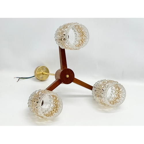 125 - A 1960’s Mid Century teak ceiling light with glass shades. 43x42x46cm