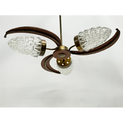 127 - A 1960’s Mid Century teak ceiling light with glass shades. 57x48cm.