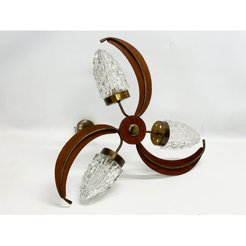 127 - A 1960’s Mid Century teak ceiling light with glass shades. 57x48cm.