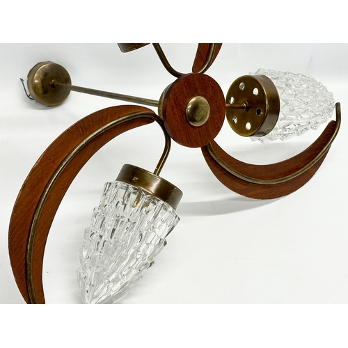 127 - A 1960’s Mid Century teak ceiling light with glass shades. 57x48cm.