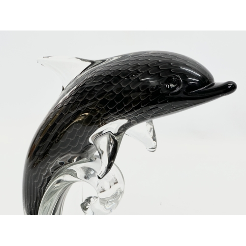 98 - A signed Swedish art glass dolphin by F.M. Ronneby. Sweden. 20x27cm