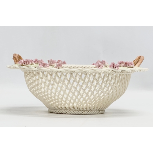 141 - A Belleek Millennium 2000 ‘Wedding Bouquet’ woven basket. 21x21x9cm