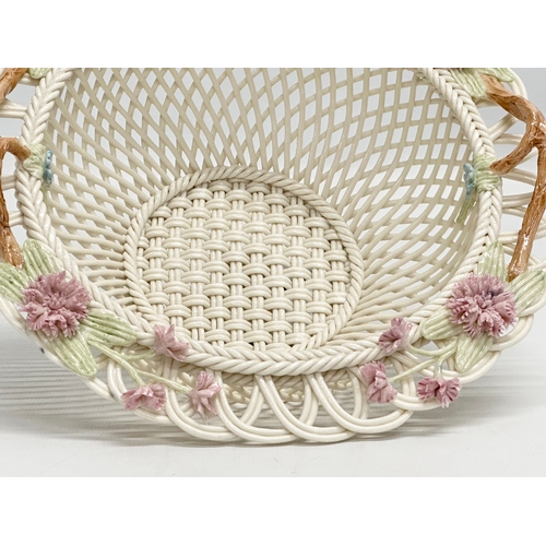 141 - A Belleek Millennium 2000 ‘Wedding Bouquet’ woven basket. 21x21x9cm