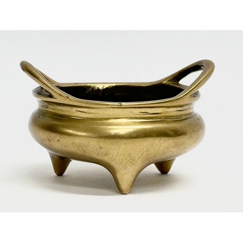 17 - An 18th/19th Century Chinese brass tripod censer with impressed interior dragon motif. Impressed Emp... 