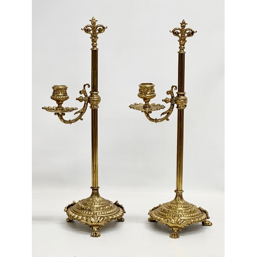 22 - A pair of large Late 19th Century Victorian brass rise and fall candlesticks. 43cm.