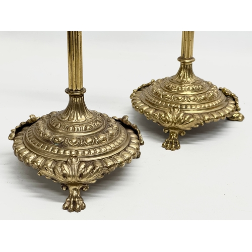 22 - A pair of large Late 19th Century Victorian brass rise and fall candlesticks. 43cm.