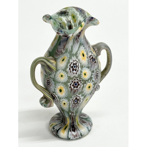 23 - Fratelli Toso. A rare Murano Millefiori glass vase by Fratelli Toso. 7x5x10cm.