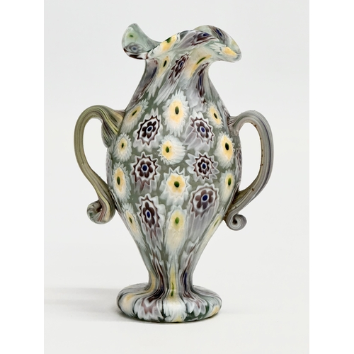 23 - Fratelli Toso. A rare Murano Millefiori glass vase by Fratelli Toso. 7x5x10cm.