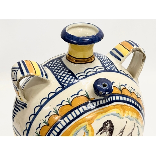 51 - An 18th Century Italian majolica enamelled canteen flask. 20x14.5x23cm.