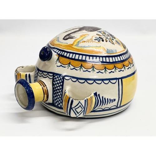 51 - An 18th Century Italian majolica enamelled canteen flask. 20x14.5x23cm.