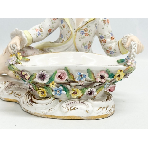 105 - John Bevington. A large Late 19th Century hand painted pottery figurine sweetmeat basket by John Bev... 