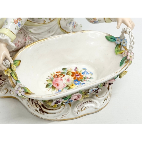 105 - John Bevington. A large Late 19th Century hand painted pottery figurine sweetmeat basket by John Bev... 