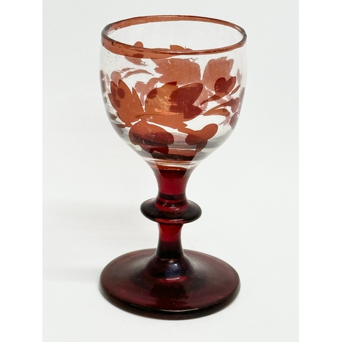 106 - Three 19th Century Bohemian ruby cordial glasses. 9.5cm. 7cm.