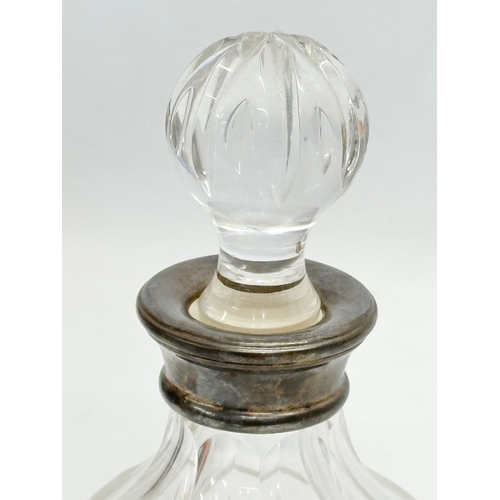 148 - Silver mounted decanter. A Late 20th Century silver mounted crystal decanter by Lawrence R. Watson. ... 