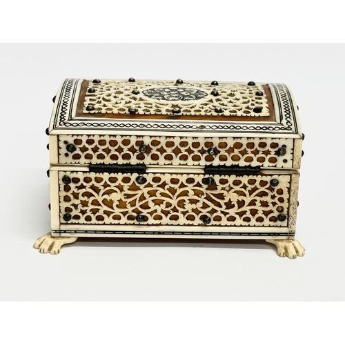 27 - A 19th Century Vizagapatam Anglo Indian bone and wood ring box. 9.5x6.5x5cm.