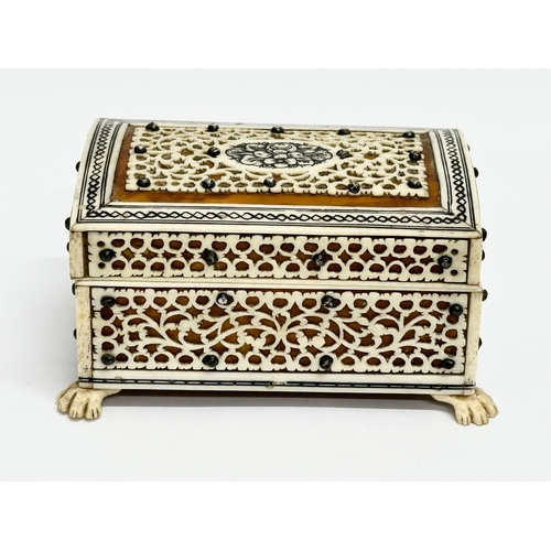 27 - A 19th Century Vizagapatam Anglo Indian bone and wood ring box. 9.5x6.5x5cm.