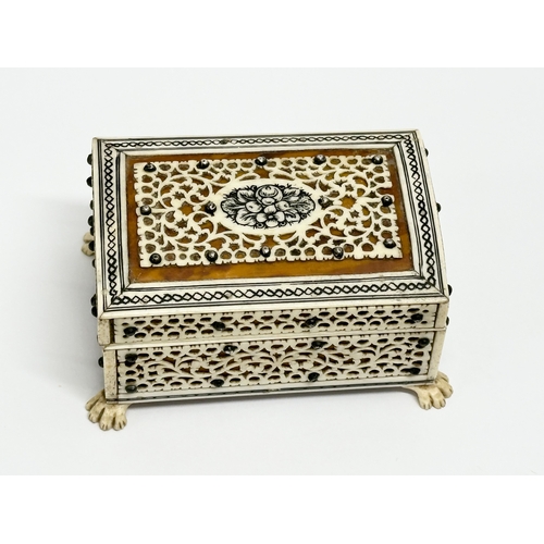 27 - A 19th Century Vizagapatam Anglo Indian bone and wood ring box. 9.5x6.5x5cm.